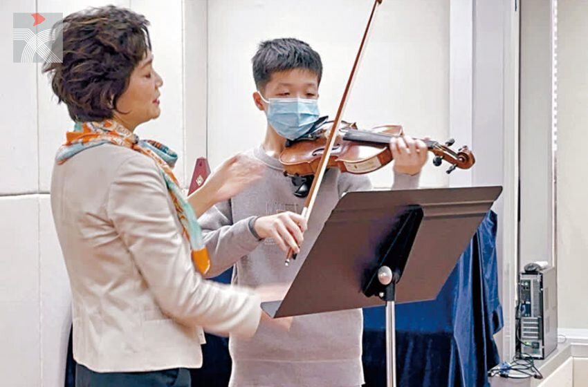  基層少年踏上紅館舞台 琴聲流淌香港精神